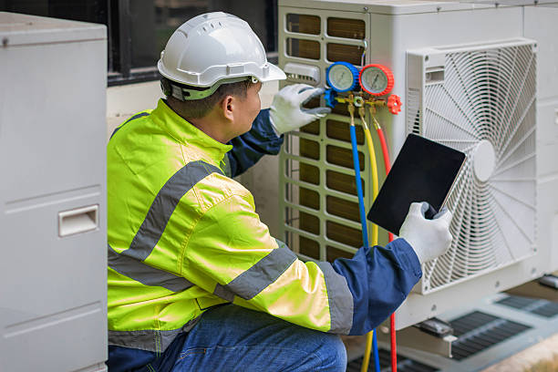 Professional Air Conditioning Repair technician working in Cedar Falls, IA